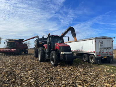 Unloading grain from combine to truck